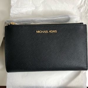 Brand new Michael Kors wristlet